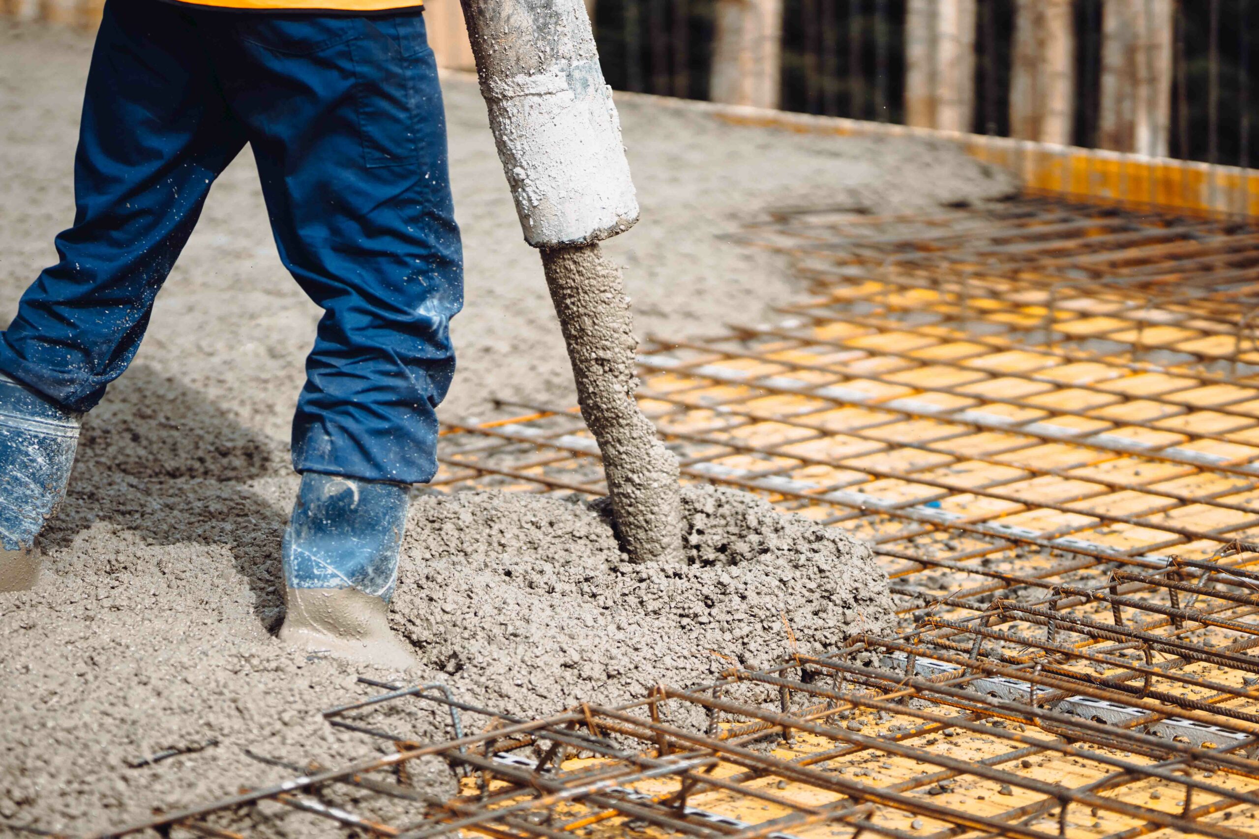 Construction,Site,Concrete,Pouring,In,Castings,On,Reinforcing,Steel,Bars